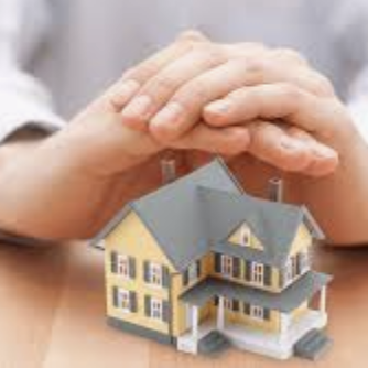 hands covering a home